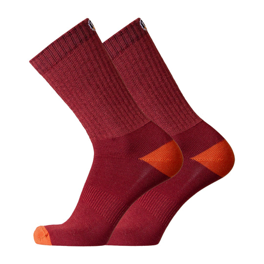 Pair of maroon socks with orange accents on a white background